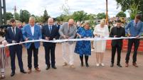 The officials are cutting the ribbon at the opening of the joint town centre on the border of Estonia and Latvia.