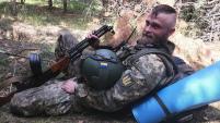 IMAGE: Serhiy Yarmolenko, Lawyer, Member of the AI Committee since 2020 pictured in military uniform on the batlefield   